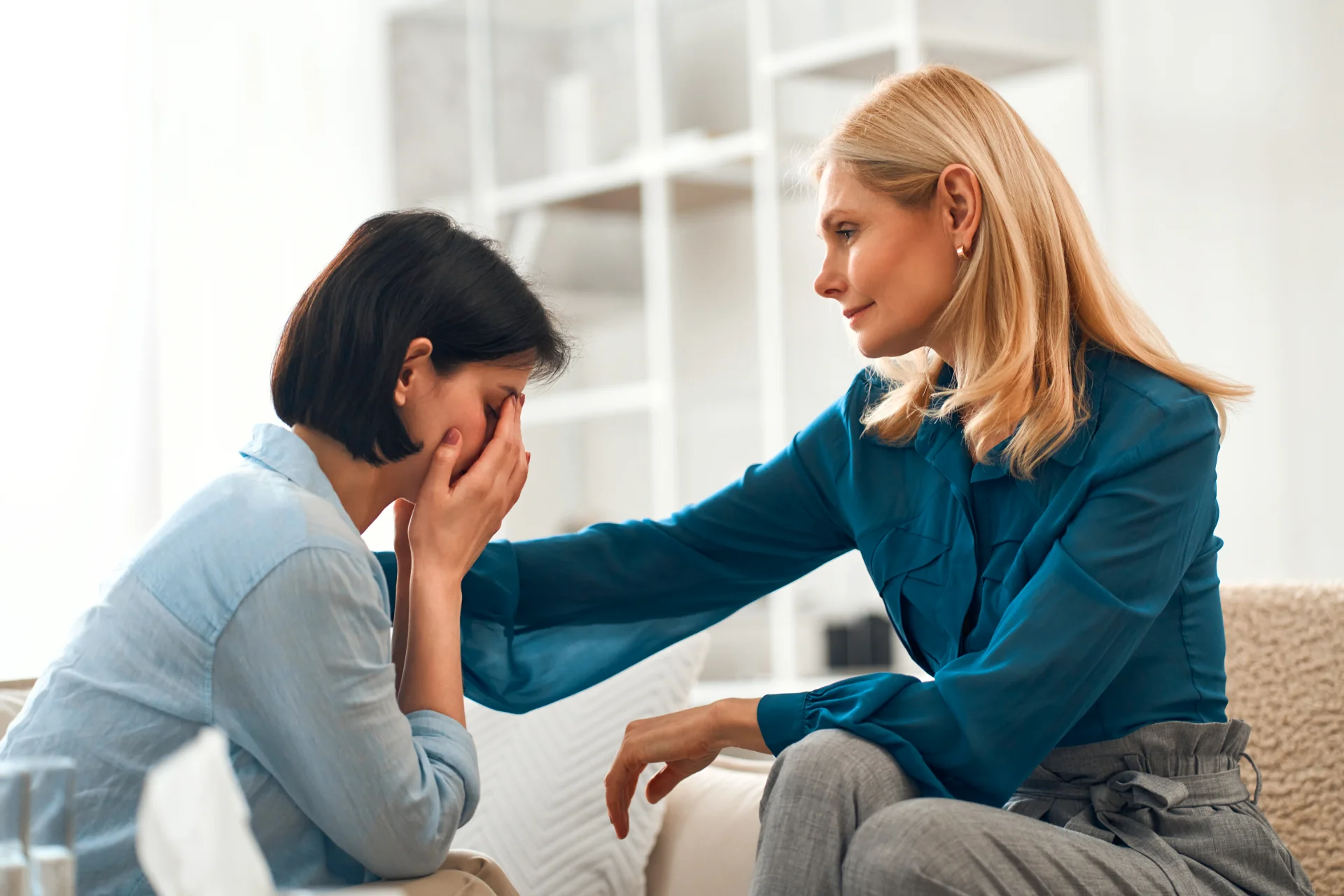 woman consoling friend during difficult time